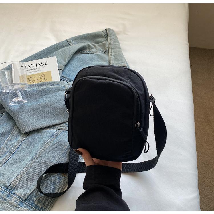 

Casual and lightweight mobile phone bag spring and summer new personalized solid color shoulder bag texture trendy messenger small cloth bag чорний
