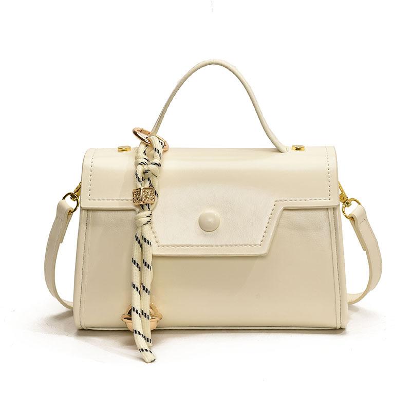 

Ручная переноска Маленькая квадратная сумка Женская Новая модная однотонная сумка через плечо белый