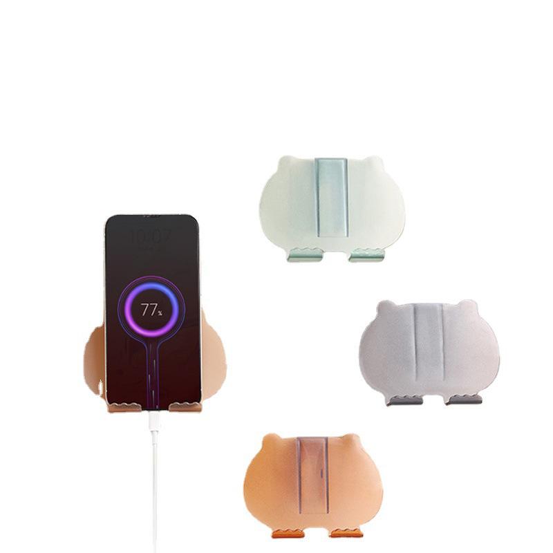

Little Bear Adhesive Phone Holder: Universal Wall Mount for Bedside or Kitchen Charging.