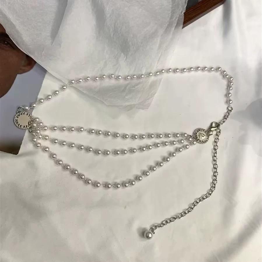 

Элегантная женская многослойная поясная цепочка с жемчужной кисточкой для платья или свитера серебряный