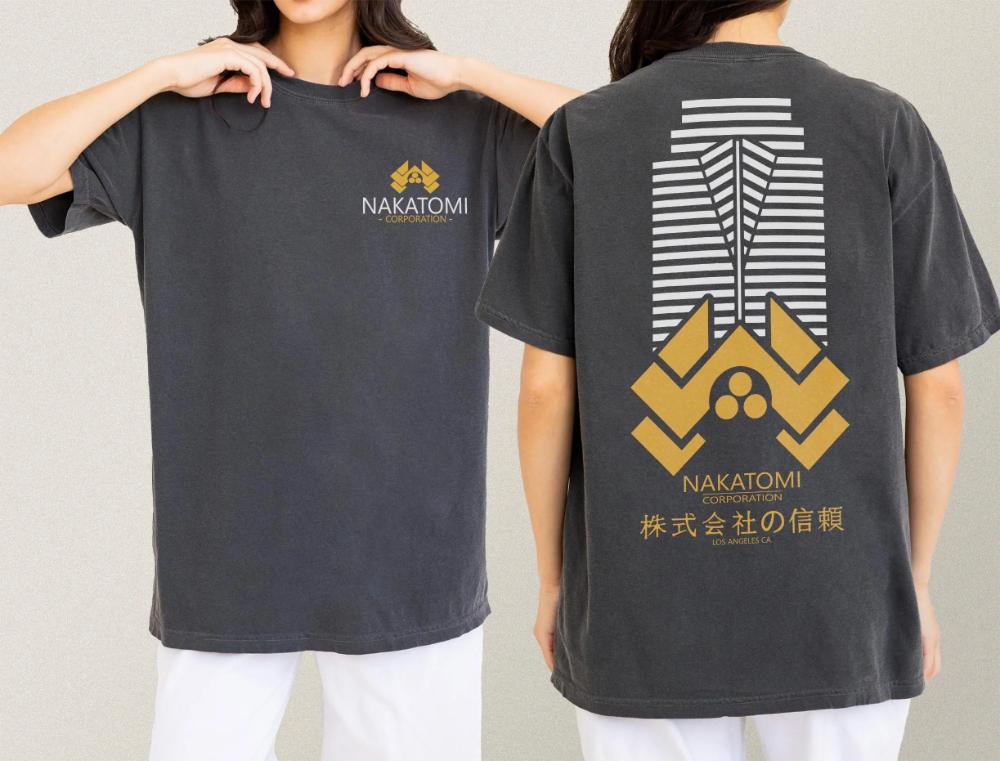 

Nakatomi Plaza Logo TShirt Retro 80s Action Die Movie Graphic Tee with Back Print Graphic Clothing Short Sleeve Shirt Unisex S