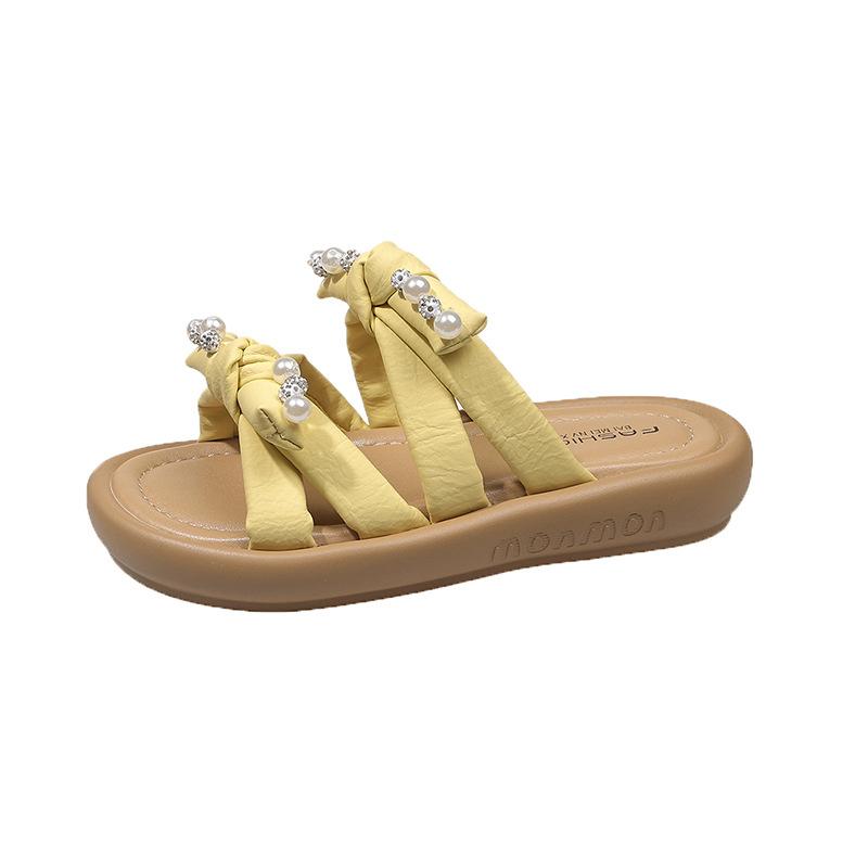 Zarte Schleife schöne coole Hausschuhe Damen Sommerbekleidung 2025 neu mit Rock Strand weiche flache Sohle Ein-Wort-Hausschuhe