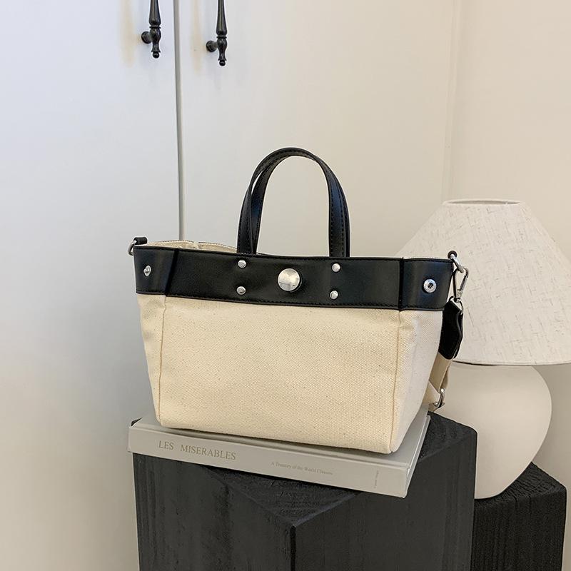 

Simple and versatile commuter shoulder women s bag New large-capacity canvas bag Portable contrasting messenger bag