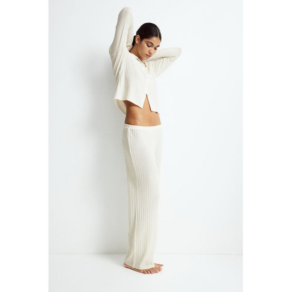 

Трикотажные брюки в рубчик HM кремового цвета