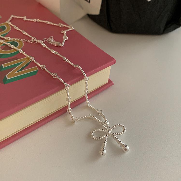Elegant Silver Bow Knot Necklace: Versatile, Light Luxury Design for Women