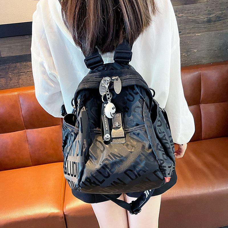 

Trendy Lettered Black Portable Traveling Backpack Female 2024 New Fashion Casual Fancy Backpack Travel Bag Medium Letter Black