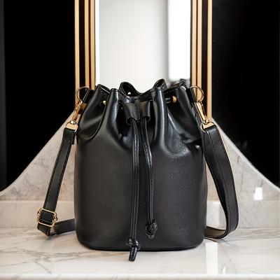 Elegant Black Drawstring Bag with Golden Hardware Accents Adjustable Shoulder Strap, Perfect for Daily Use, Handbag