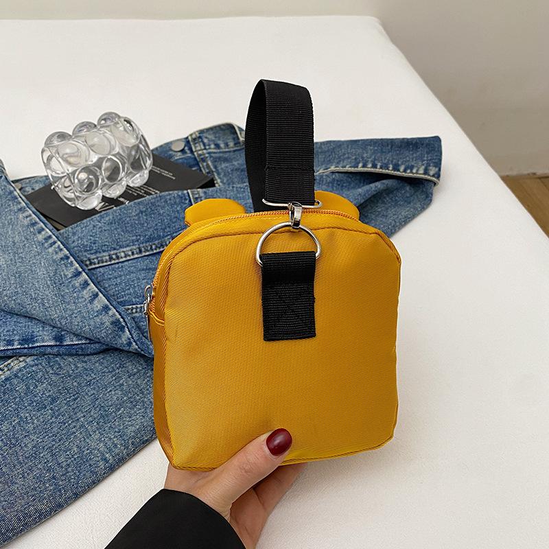 Three-color patch small bag female new dog change handbag cartoon cute student hand mobile phone bag versatile