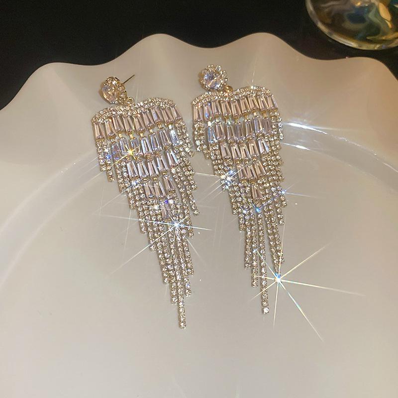 Silver Zirconia Bow Tassel Earrings: Korean Style, Exaggerated Luxury Ear Stud Ornaments.