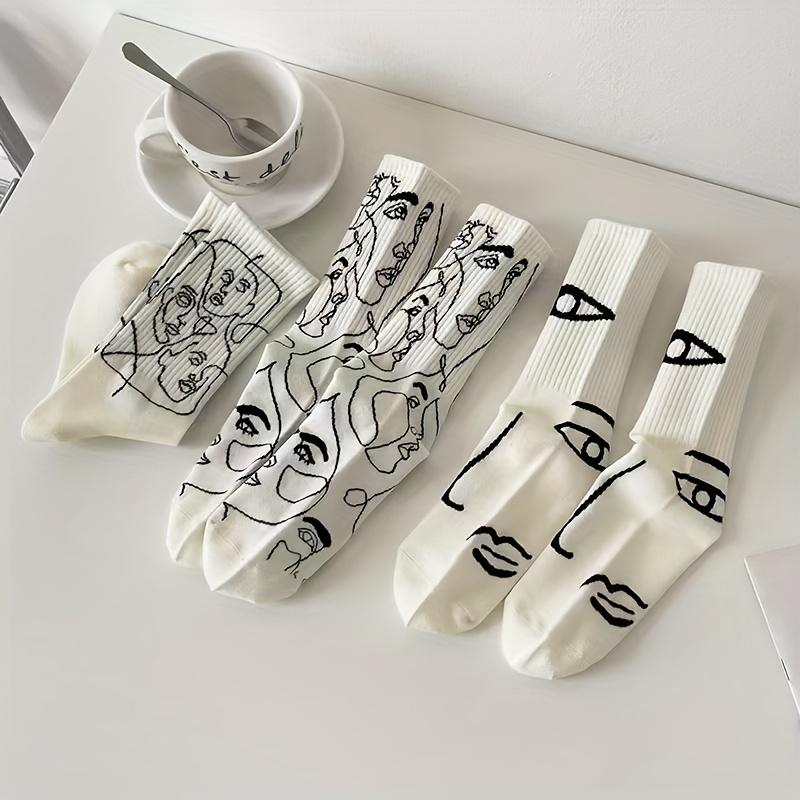 

3 pairs of women s abstract line art tube socks - black and white hand-painted portrait design