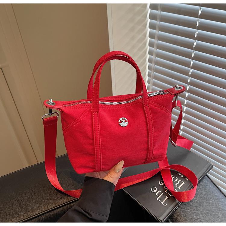 

Canvas bag women s summer new niche design messenger bag simple and versatile portable work small square bag бордовый