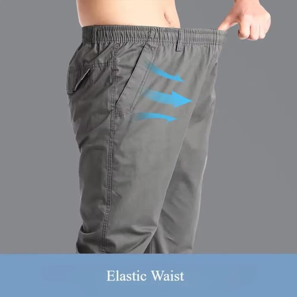 Wiosenne jesienne modne spodnie casualowe dla mężczyzn bawełniane spodnie cargo w jednolitym kolorze z elastyczną talią proste nogawki streetwear męskie spodnie joggers