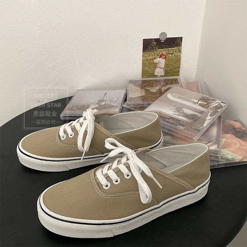 You can step on the heel and half-drag canvas shoes. Women wear white shoes. Women are versatile and pedal lazy shoes 518.