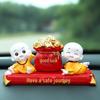 Creative Little Monk Maitreya Buddha Car Ornament: Cute, Shaking Head Resin Doll for Car Interior Decoration and Safety.