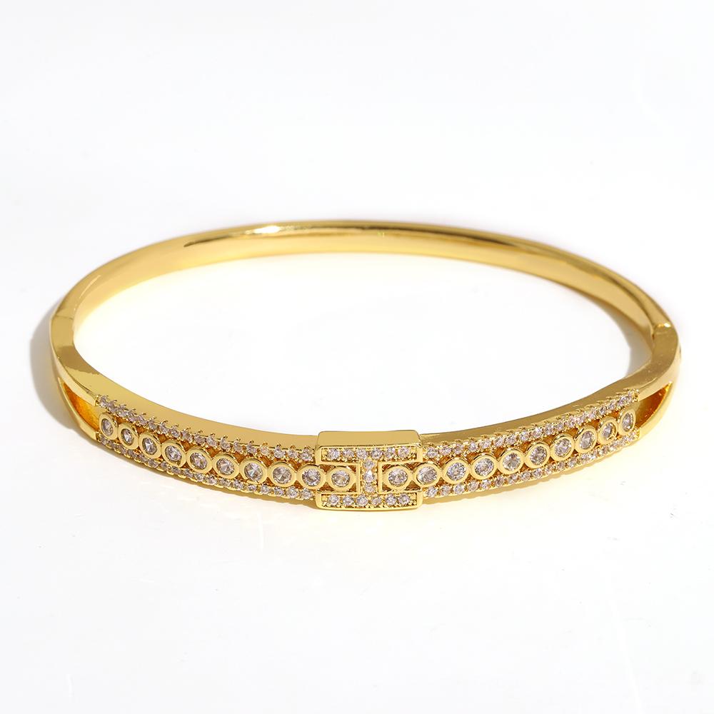 Luxuriöses funkelndes Strass-Armband, goldplattiert, für Damen, exquisites unregelmäßiges geometrisches Schleifenmanschetten-Federarmband Schmuck