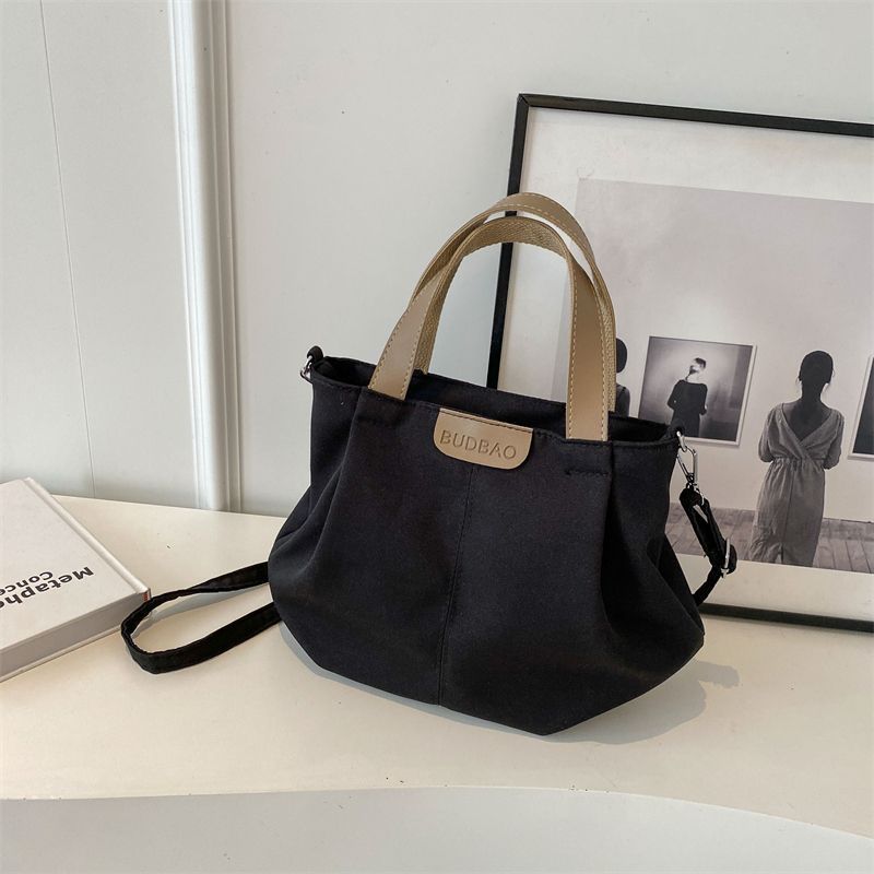 Casual canvas bag women's new versatile simple shoulder handbag fashionable large-capacity student class shoulder bag