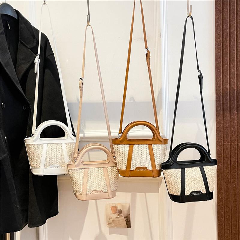 Casual fashion portable bucket bag women's summer new straw shoulder bag texture splicing messenger bag