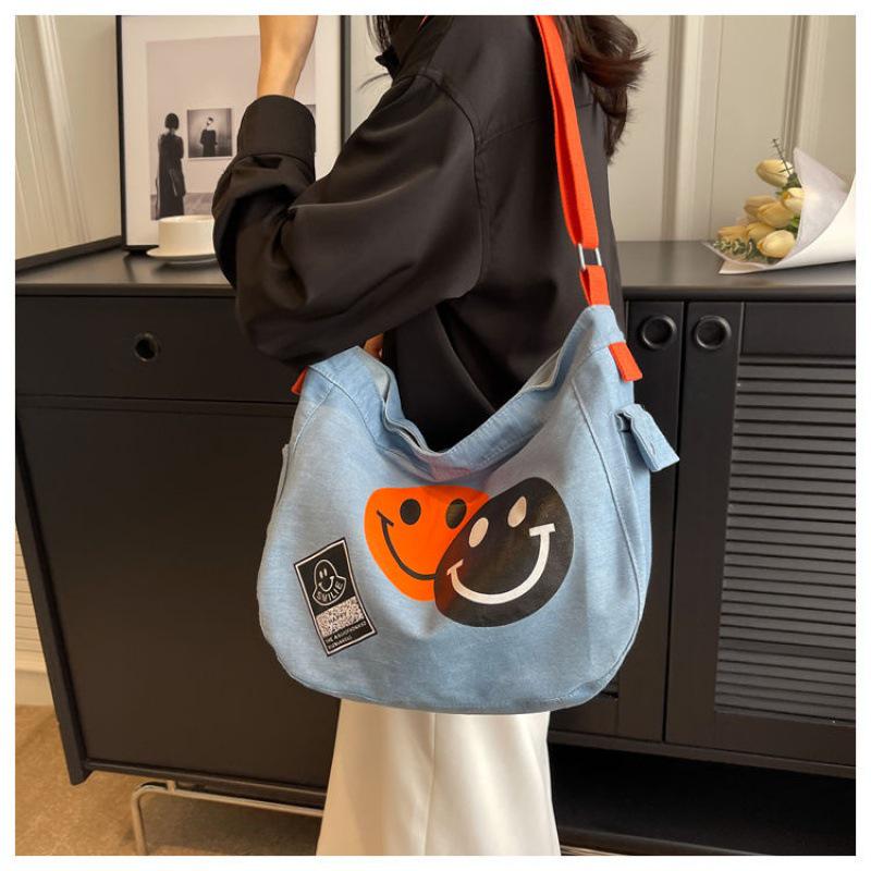 2024 New Korean Style Women's Denim Crossbody Bag: Artistic Smiley Face Canvas with Wide Shoulder Strap