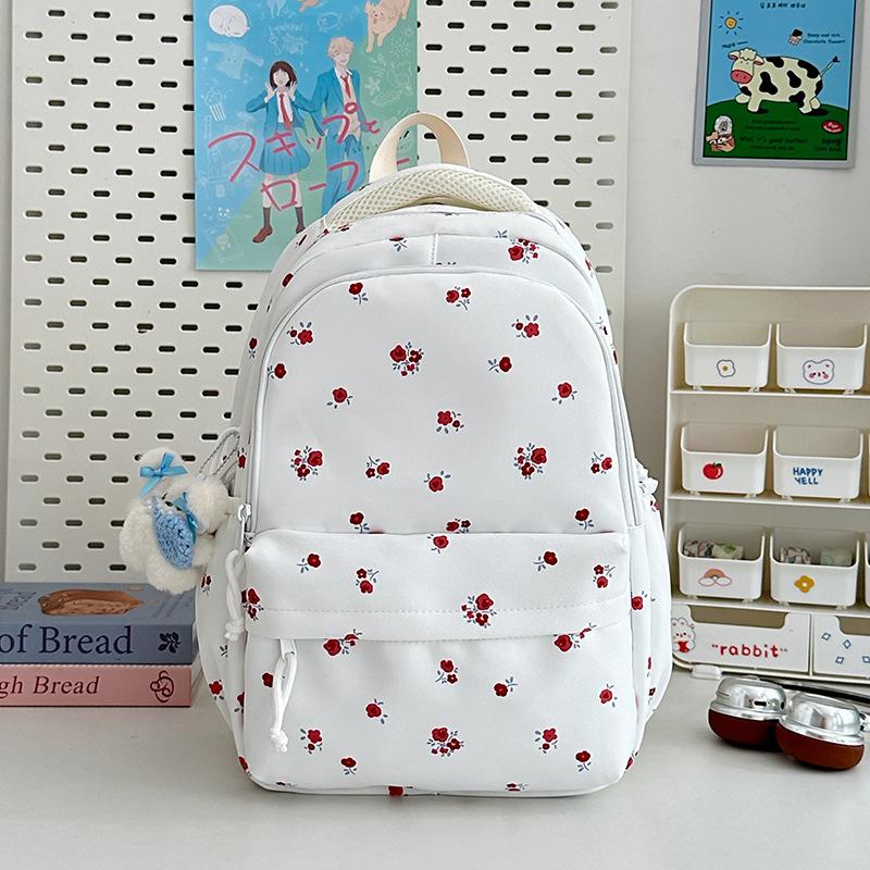 The new schoolbag is high-value, fresh and sweet floral backpack, and the lightweight spring outing backpack for junior high school students.