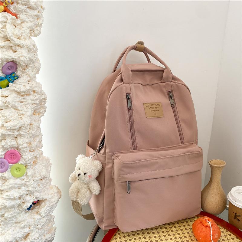 Korean version of schoolbag female college student versatile large-capacity portable lightweight and simple junior high school student travel backpack