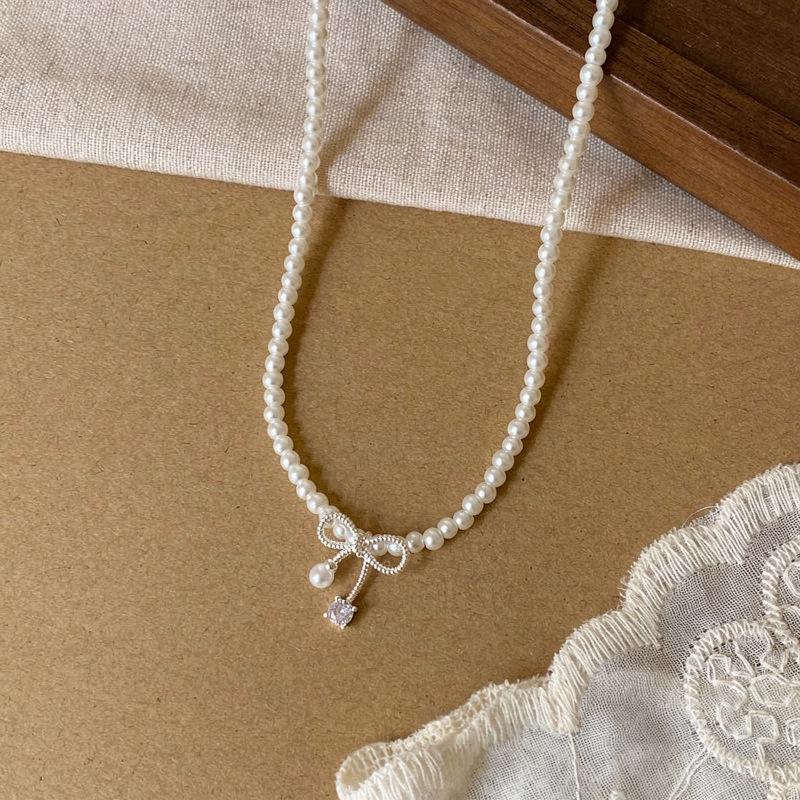 Elegante Perlen-Schleife Zirkon Anhänger Halskette für Damen - Stilvoller Choker mit High-End-Gefühl.