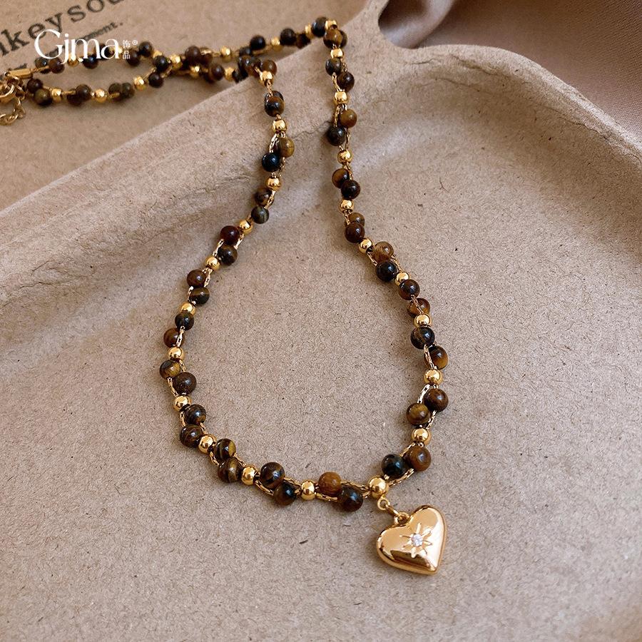 Collana con perle in occhio di tigre placcato oro 18 carati, catena per clavicola di lusso leggero, collana versatile retrò per donna