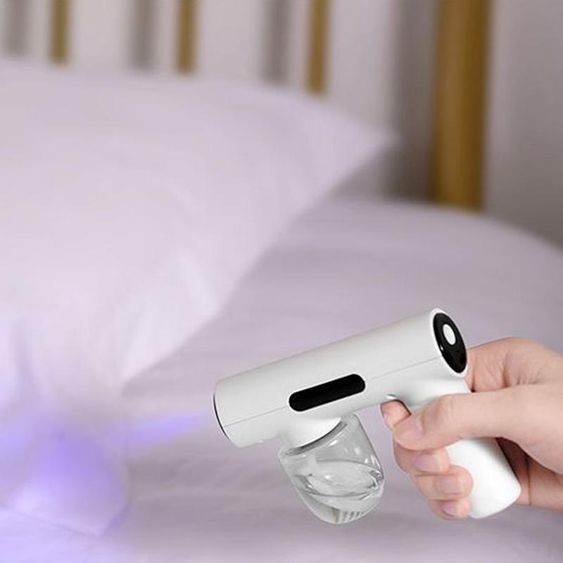 Tragbare Hand-Elektro-Befeuchtungssprühpistole Haushalts-Reisebedarf Zerstäubtes Blaues Licht Wiederaufladbare Desinfektionspistole