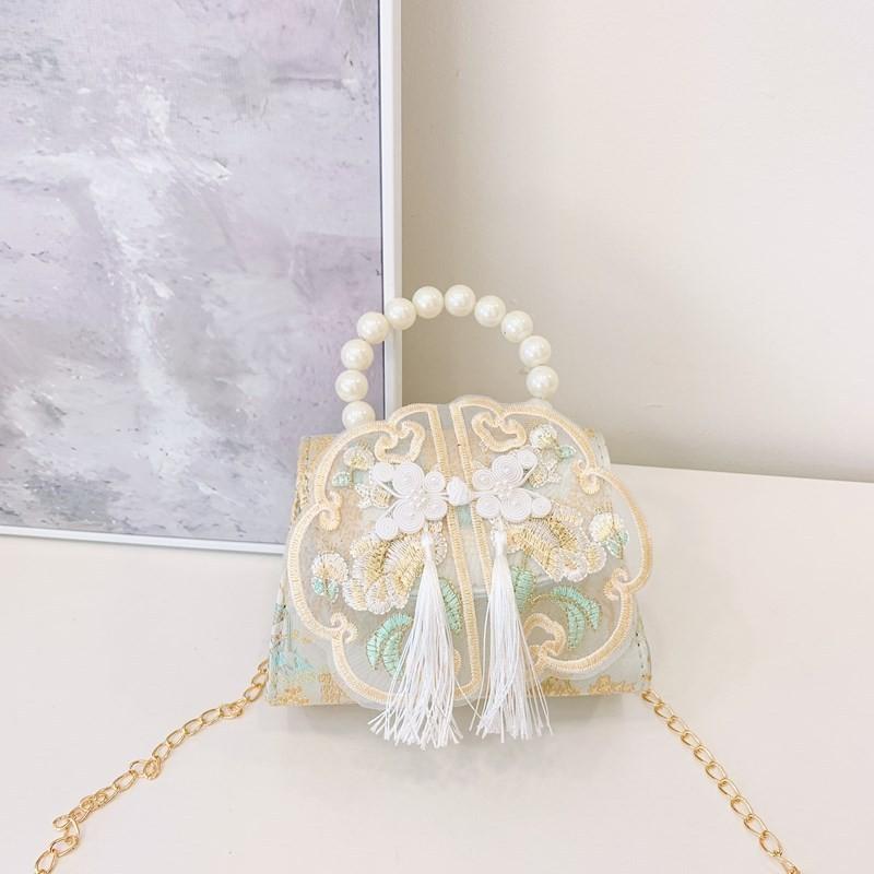 

Fashionable Pink Pearl And Tassel Girls Handbag With Unique Geometric Print Design Light Blue