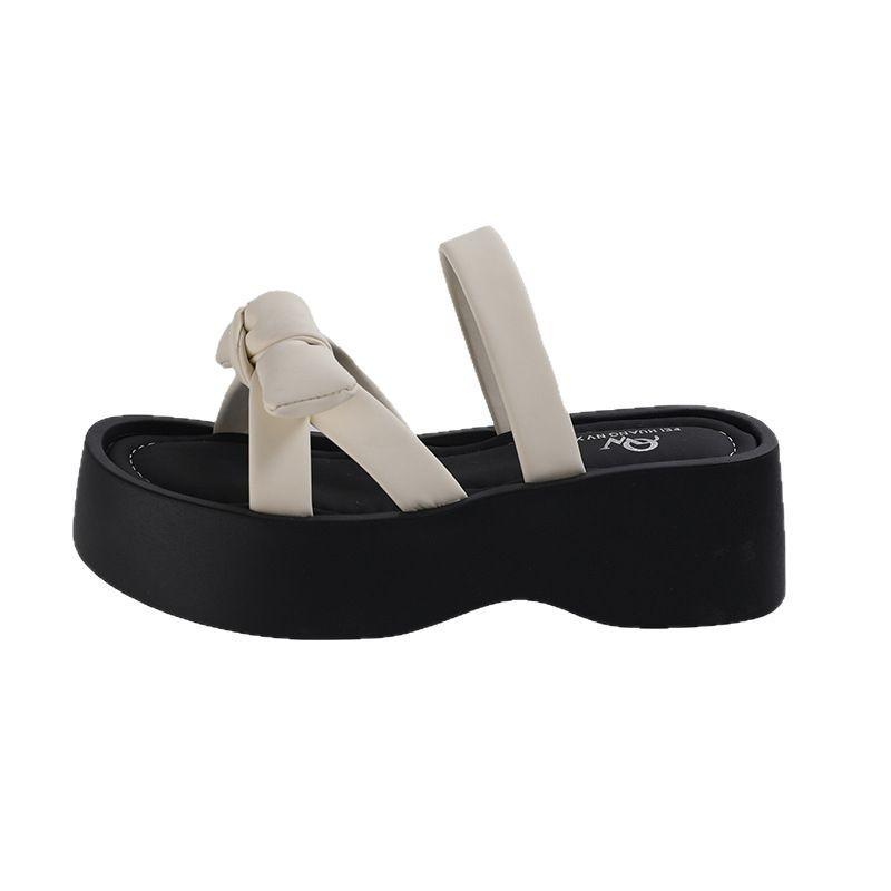 Bow one-word thick-soled slippers for women's summer wear 2025 new white heightening skirt cool slippers