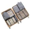 Seven-Piece Travel Packing Bag Set: Clothes, Underwear, Cosmetics, and More.