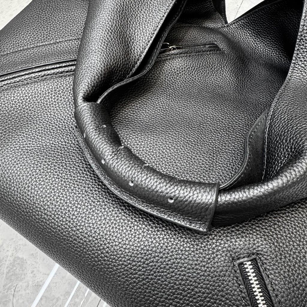 Cross-border first-layer cowhide commuter large-capacity women's bag zipper triangle bag versatile portable shoulder lazy wind underarm bag