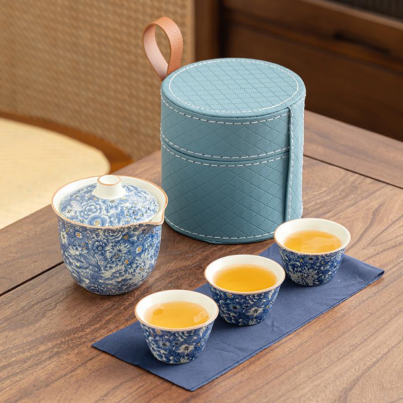 

Chinese Ru kiln blue and white travel tea set, three cups of hand-held portable cover bowl camping outdoor tea set