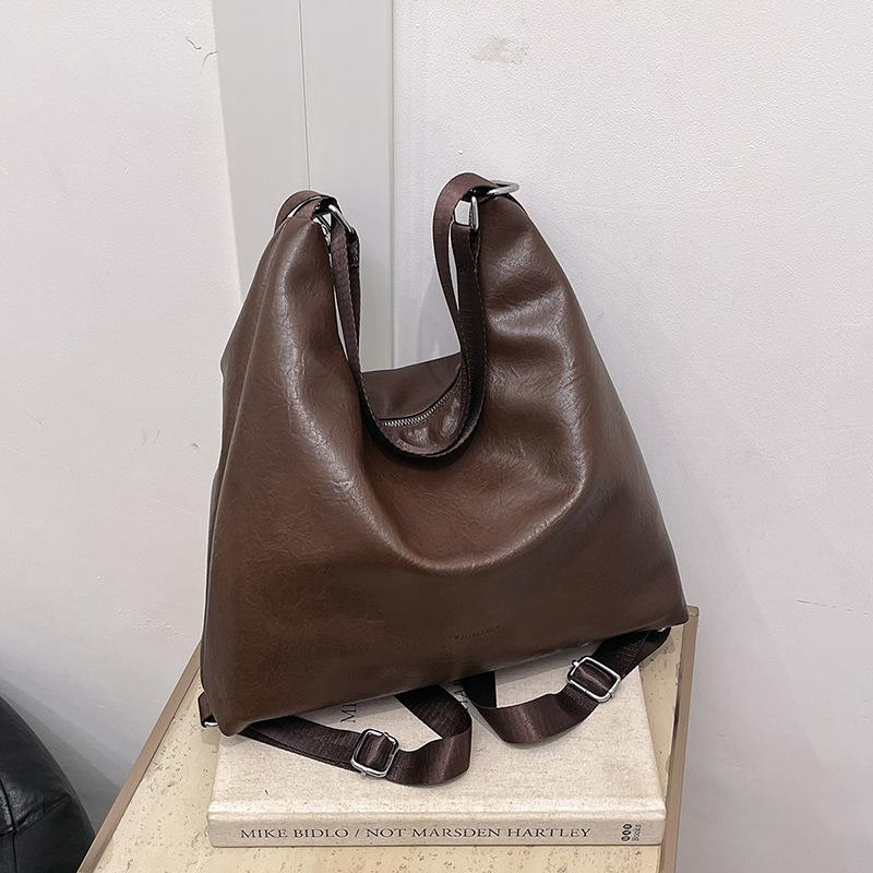 

Bucket bag women s high-end retro armpit bag high-end shoulder bag commuting oblique span bag women s versatile темно-коричневого