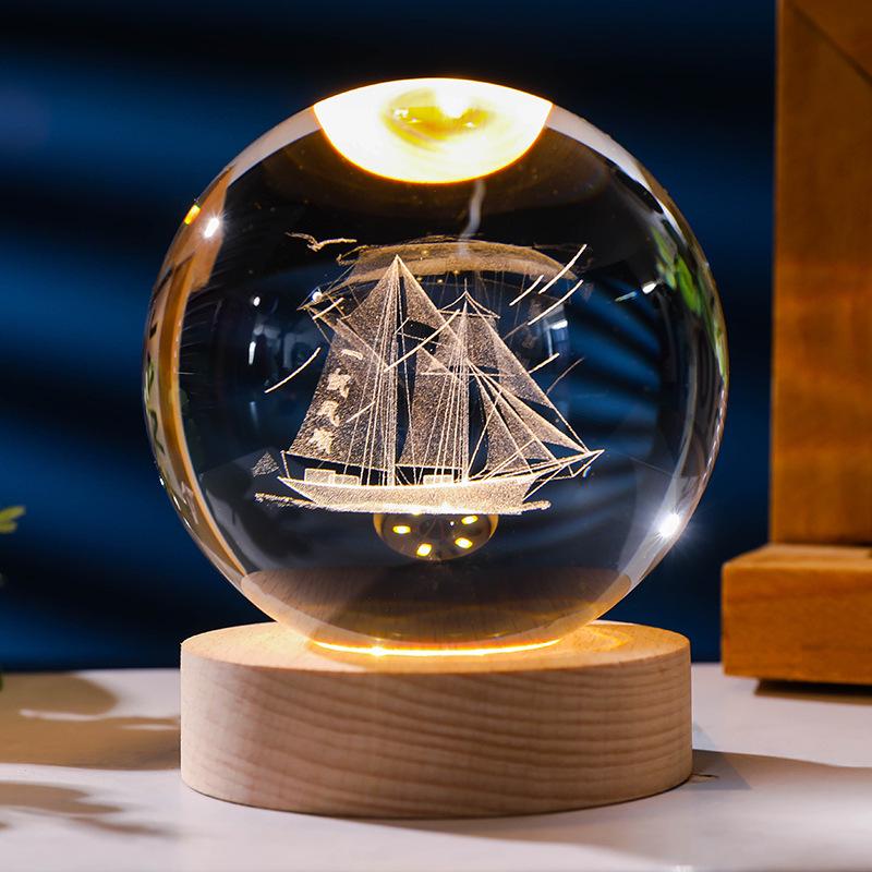 Flickering Crystal Ball Night Light with Engraved Solid Wood Base - Perfect as a Birthday Gift or Creative Graduation Ornament.