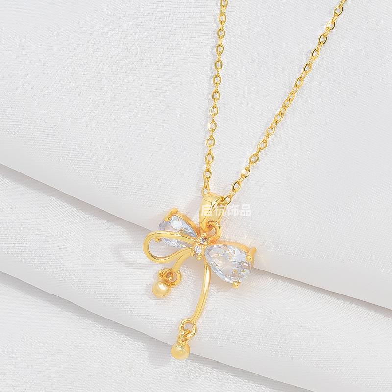 

Ожерелье-бант Женское Легкая роскошь Высокий класс Холодный ветер Инкрустированный бриллиантами Маленький кулон-колокольчик с украшениями