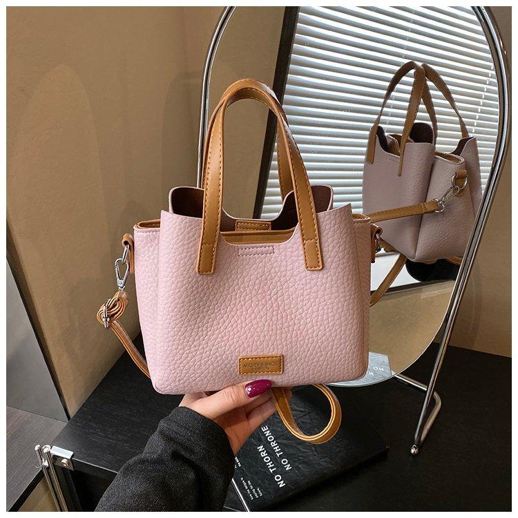 

Spring and summer fashion foreign gas bucket simple light luxury high-end women magnetic buckle messenger bag women without pendant розовый