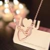 Dual Heart Stylish Necklace For Women Featuring Opulent Gold Plating And Eyecatching Stones Zirconia