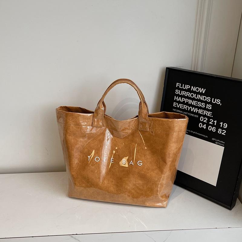 

Большая сумка женская 2025 новая модная весенняя сумка-тоут в стиле кэжуал, простой личности, для поездок на работу коричневый