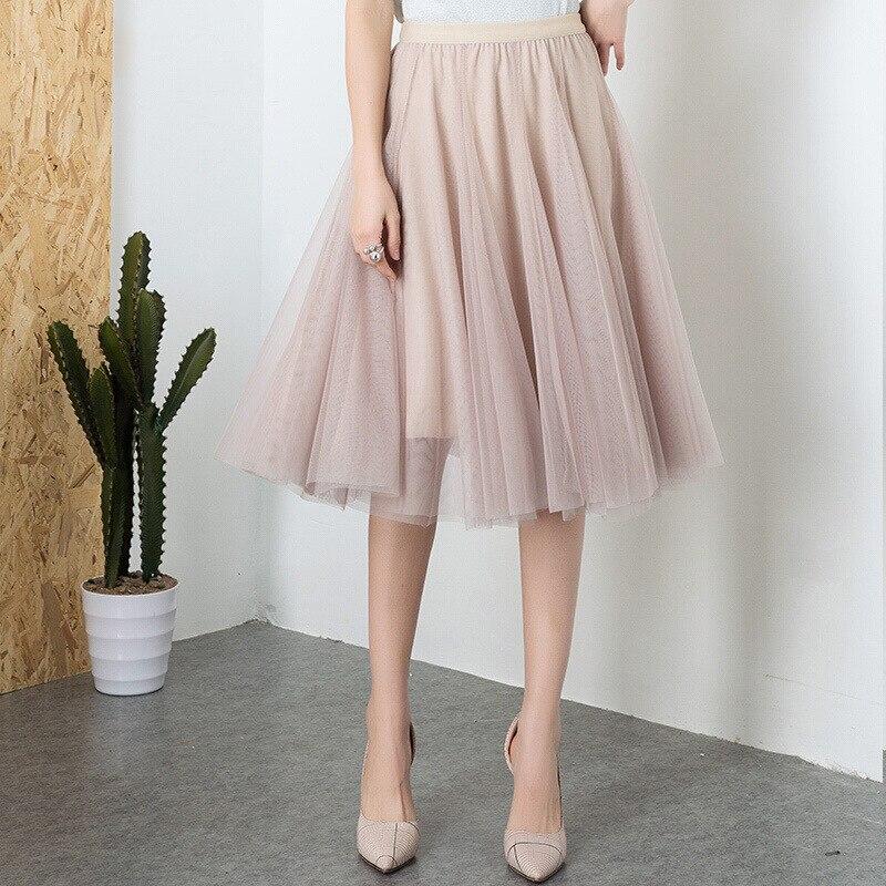 

Qooth Сладкая тюлевая сетчатая юбка до колена Женская эластичная талия Фея Плиссированная юбка Простая повседневная QT2221 One Size