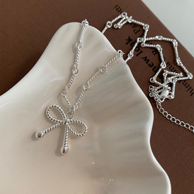 Elegant Silver Bow Knot Necklace: Versatile, Light Luxury Design for Women