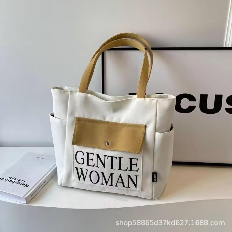 

Large capacity canvas bag women s 2026 new tote bag casual versatile student class shoulder commuting tote bag хакі