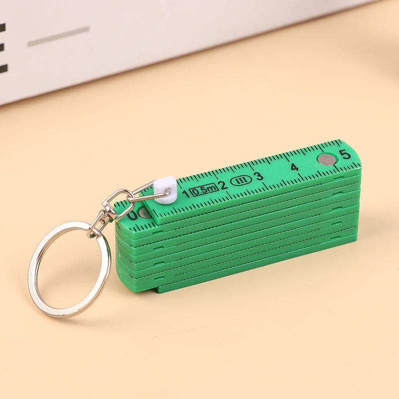 1 Stück 0,5 Meter 10-fach Schlüsselanhänger Kunststoff Hochpräzisions-Faltmaßstab Kann für Reisen, Holzbearbeitung, Maurerarbeiten, Heimwerken aufbewahrt werden