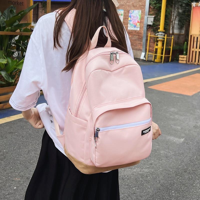Neuer Rucksack mit großem Fassungsvermögen, schlichte und kontrastierende Farben für Mittel- und Oberschüler
