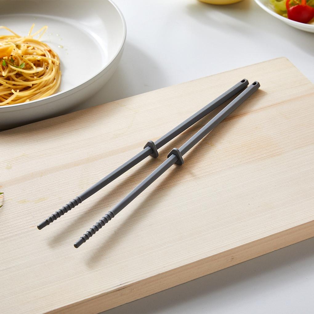 

1 pair of silicone cooking chopsticks that don t touch the floor