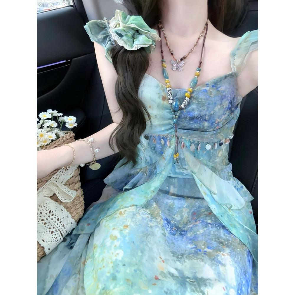 Beach skirt 2025 summer new suspender temperament dress women's summer printing thin dress holiday style