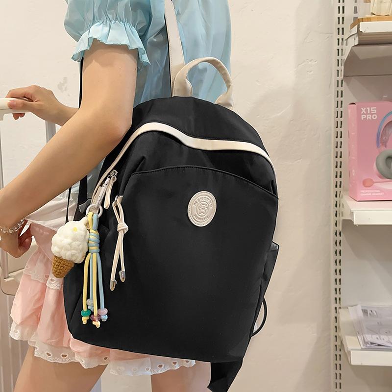 

Lightweight nylon cloth small backpack women s new fashion waterproof Oxford cloth travel bag commuter simple backpack single bag чорний