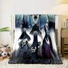 The pattern depicts dark, stylized insect-like characters in a mystical scene. for all seasons blanket lunch break throw gift