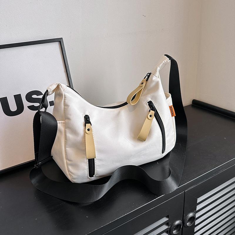 

Crossbody dumpling bag fashionable and casual large-capacity women s bag summer new Oxford spinning student class commuter bag белый