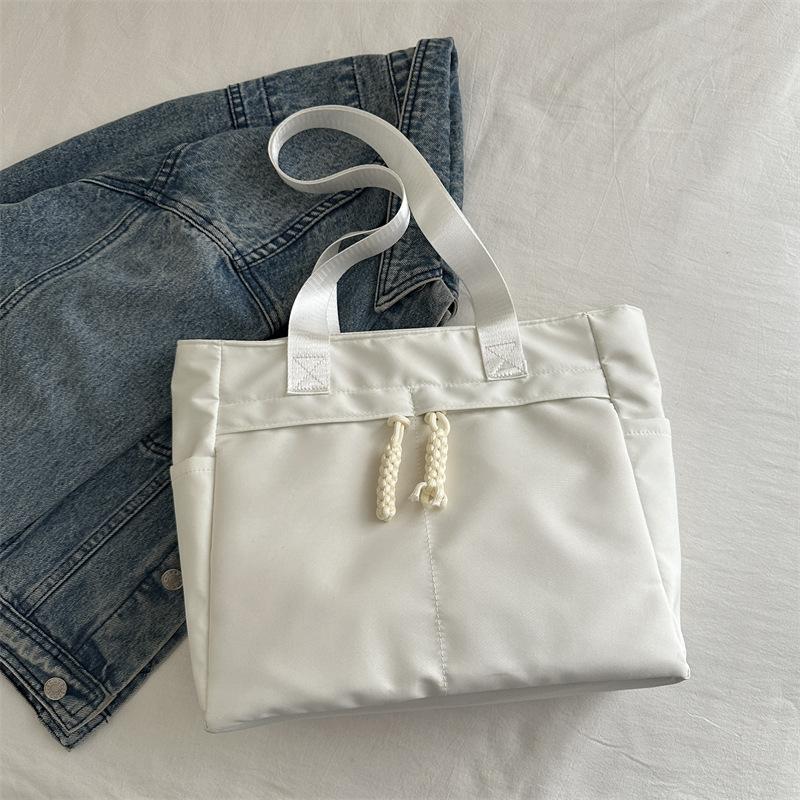 

2025 новая сумка-тоут женская иностранного стиля большая вместительная холщовая сумка модная высококачественная нишевая сумка через плечо с узлом веревки белый