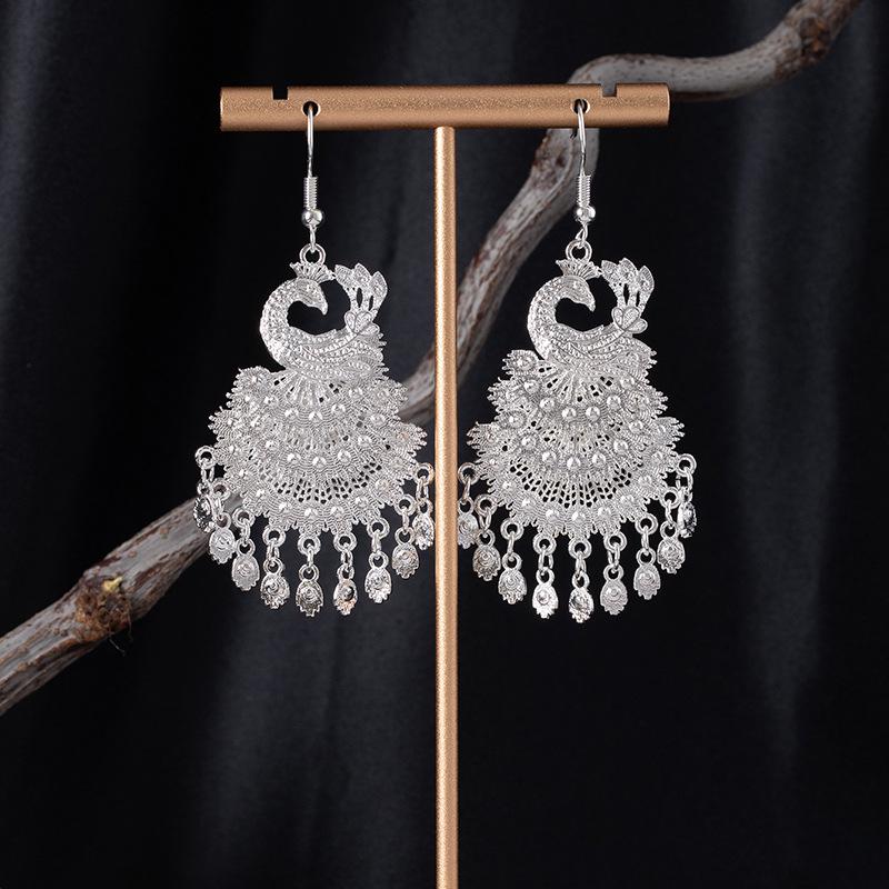 Bohemian Ethnic Miao Silver Tassel Earrings with Butterfly, Peacock, and Flower Design for Women – Long Dangle Jewelry for Travel Photos.